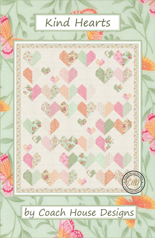 'Kind Hearts' lap quilt pattern by Coach House Designs is a filled with pastel colored heart blocks. Each heart is made of complimentary colors in soft hues of pink, greens, peach and orange on a cream color background.